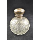 A cut glass bulbous scent bottle with silver mount, monogram to top - H12cm CONDITION REPORT dents