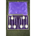 A cased set of six silver apostle spoons, together with sugar tongs, Sheffield 1912, maker