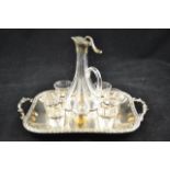 A silver plated liqueur set comprising lobed liqueur decanter, six glasses and two handled tray,