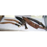 Five various old kukris with scabbards