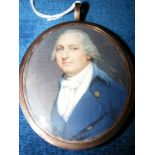 Early 19th century miniature portrait of gentleman in gilt oval frame, having lock of hair to