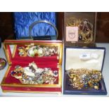 Four boxes of costume jewellery including earrings, necklaces, etc