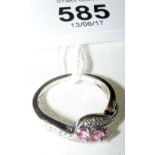 A 9ct gold pink tourmaline and diamond cross-over ring