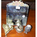 A decorated brass inkwell, mirror, etc