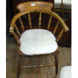 An antique elm "Captain's" chair