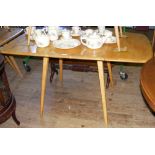 An Ercol "Golden Dawn" drop-leaf kitchen/dining table