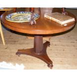 A 104cm diameter Victorian mahogany tilt-top breakfast table on octagonal column and platform base