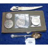 A Victorian silver berry spoon, silver crowns, ivory letter knife, etc