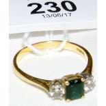 An emerald and diamond ring in gold setting