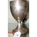 A 16cm high silver goblet with anchor and cannon engraved decoration