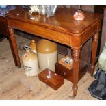19th century mahogany fold-over tea table on fluted supports having cross-banded top