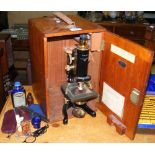 A microscope by Watson & Glover in fitted mahogany case