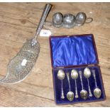 A cased set of six silver coffee spoons, pierced and plated fish server and a pewter condiment set