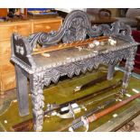 A carved oak window seat