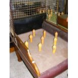 An old Northamptonshire Skittles table with turned wood balls and skittles