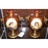 Pair of 19th century hand painted continental cranberry glass vases, the oval panels painted with
