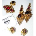 A five-piece suite of decorative yellow metal jewellery set with cabochon stones