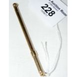 A 9ct gold swizzle stick