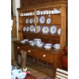 A large Victorian pine dresser with plate rack over and three drawers to the apron - 224cm
