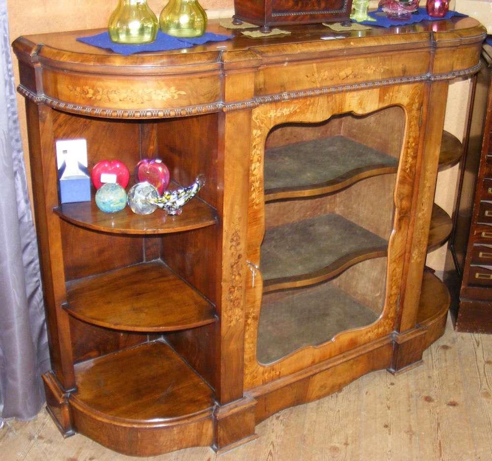 A Victorian inlaid walnut credenza enclosed by glazed centre door