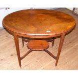 An Edwardian inlaid mahogany two-tier occasional table on tapering supports