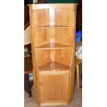 The matching Ercol "Golden Dawn" corner display cabinet with cupboard to the base