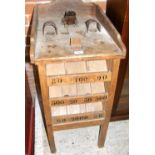 An antique wooden amusement arcade game