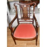 An Edwardian inlaid armchair