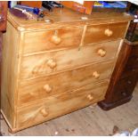 A stripped and waxed Victorian pine chest of two short and three long graduated drawers