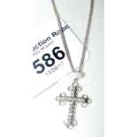 A 9ct white gold diamond mounted cross and chain