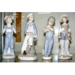 Lladro figure of seated boy, together with three others