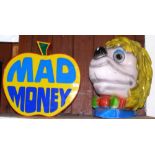 An illuminated advertising arcade display "Mad Money", together with a moulded head