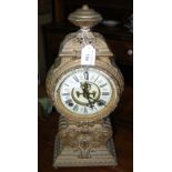 A decorative gilt brass striking mantel clock - 42cm high