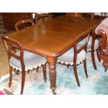 A 175cm x 100cm (centre leaf in) Victorian mahogany wind-out dining table on turned and taper reeded