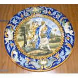 A 41cm diameter Labino faience charger with allegorical scene to the centre panel