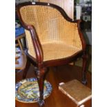 A 19th century mahogany framed library armchair with cane work seat and back rest