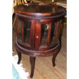 A 50cm diameter mahogany specimen cabinet with panelled glass sides