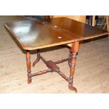 A Victorian mahogany Sutherland table with turned supports and stretcher
