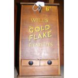 A 6D coin operated Will's "Gold Flake" Cigarettes dispenser