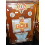 A Beromat coin in the slot "One Armed Bandit" type amusement arcade machine
