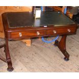 A 19th century mahogany library table with two drawers to the apron and leather top
