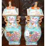 A pair of 37cm high overall Chinese famille rose lidded vases with Fo dog surmounts