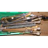 A large quantity of assorted brass and other garden syringes, stirrup pump, etc