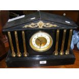 A Victorian mantel clock with Corinthian column design