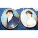 A pair of early 19th century miniature portraits of gentleman and lady in gilt oval surrounds, the