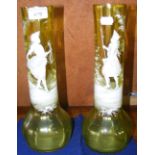 A pair of Mary Gregory 32cm high yellow glass vases