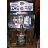 A Jennings "Tic Tac Toe" one shilling coin operated Jackpot "One Arm Bandit" - on original