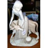 A 34cm high Lladro figure of milkmaid and cow
