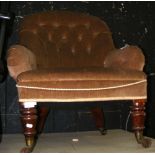 A Victorian mahogany framed easy armchair with deep button back