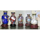 Five cloisonne vases with carved wooden bases